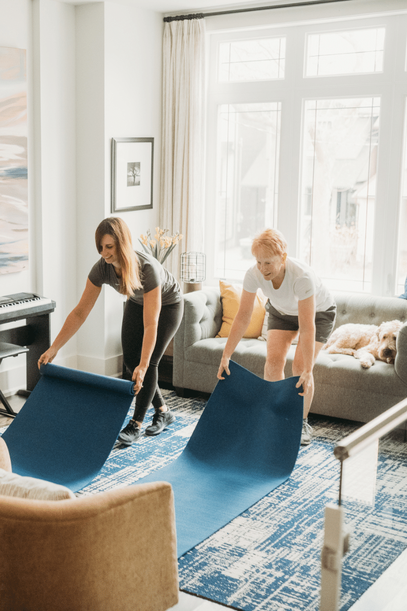 a trainer and a client prepare for an exercise routine